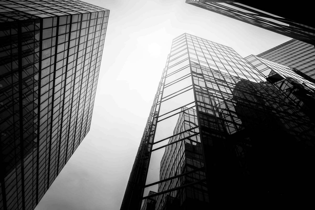 Glass office towers seen from street level